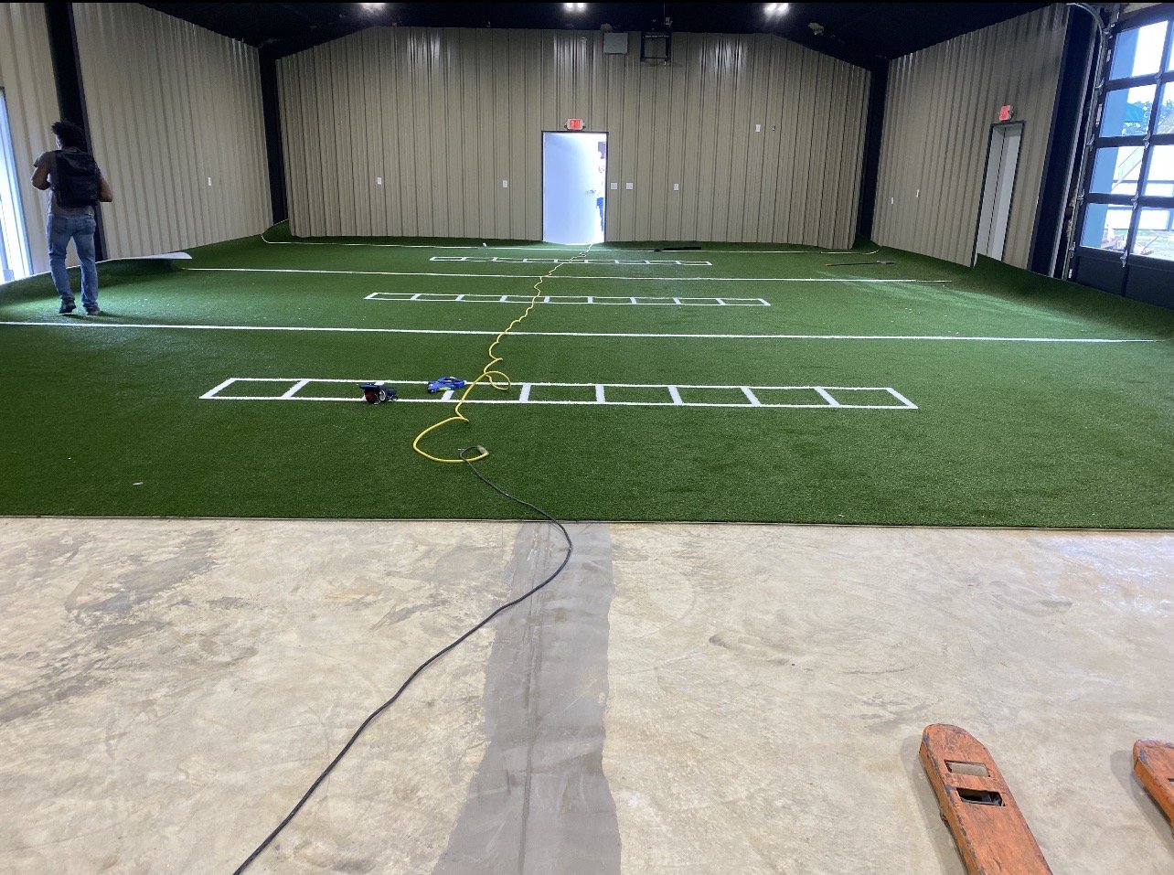 Finished turf and flooring install with agility markings